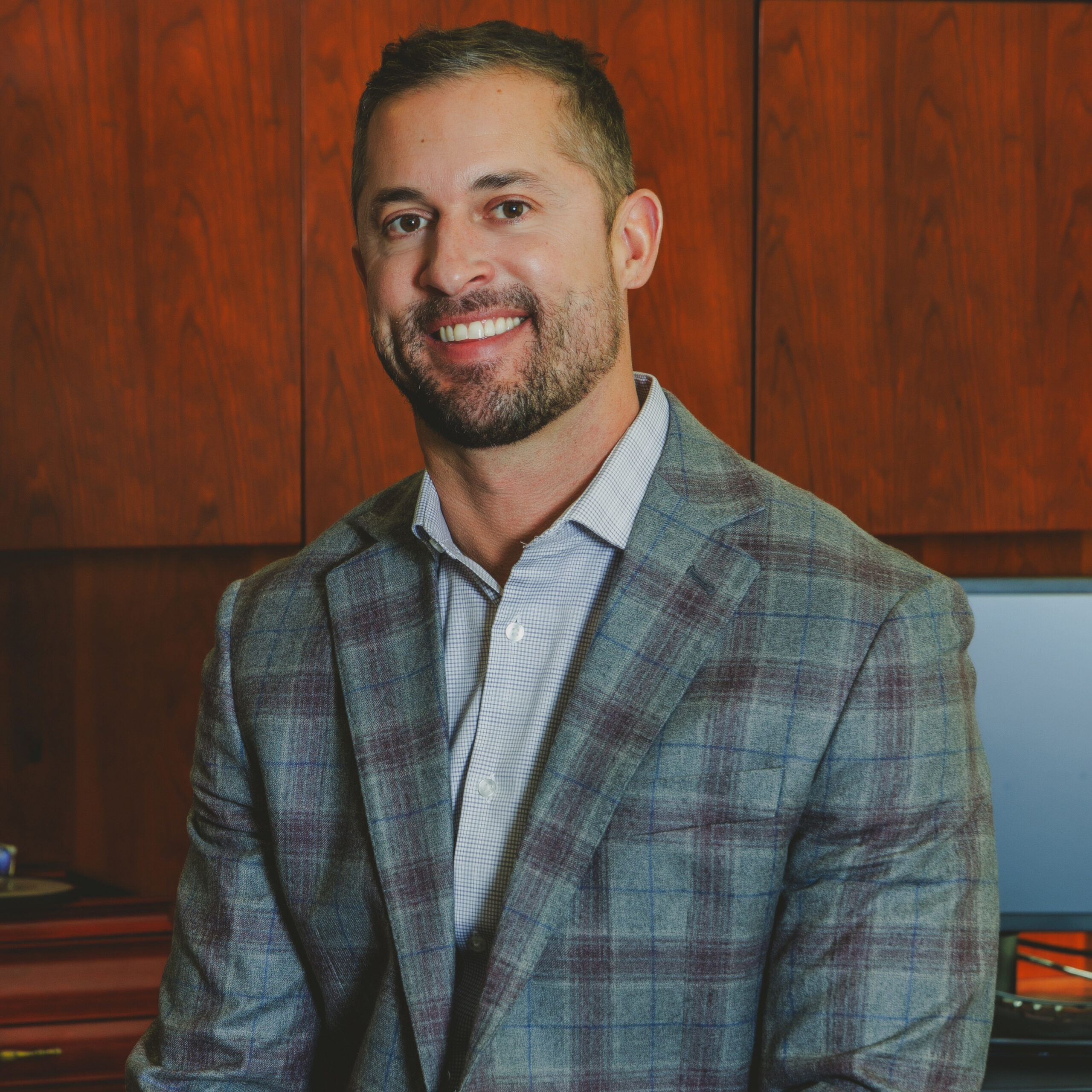 man smiling in jacket